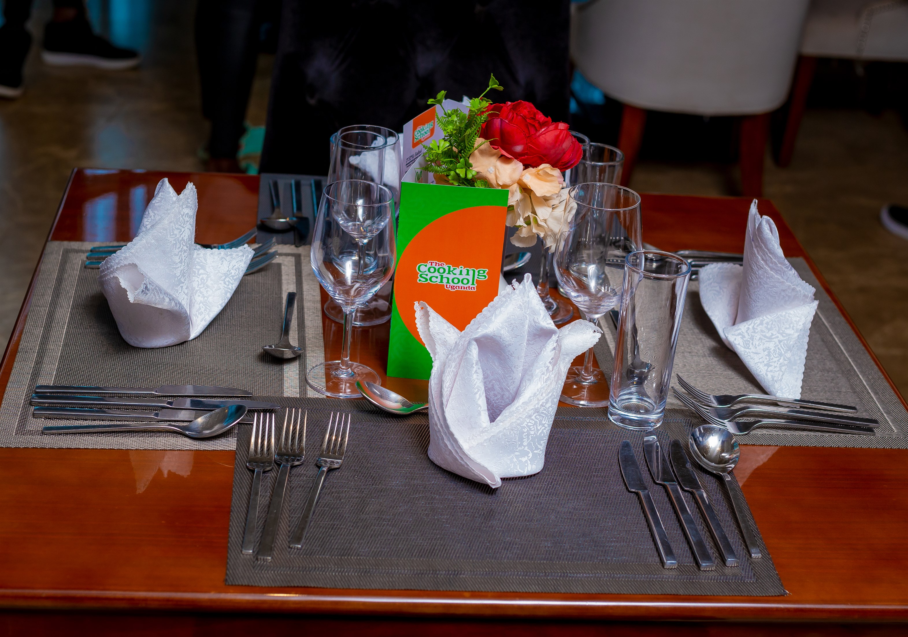 People at a concert facing the stage with various colours of paint powder in the air